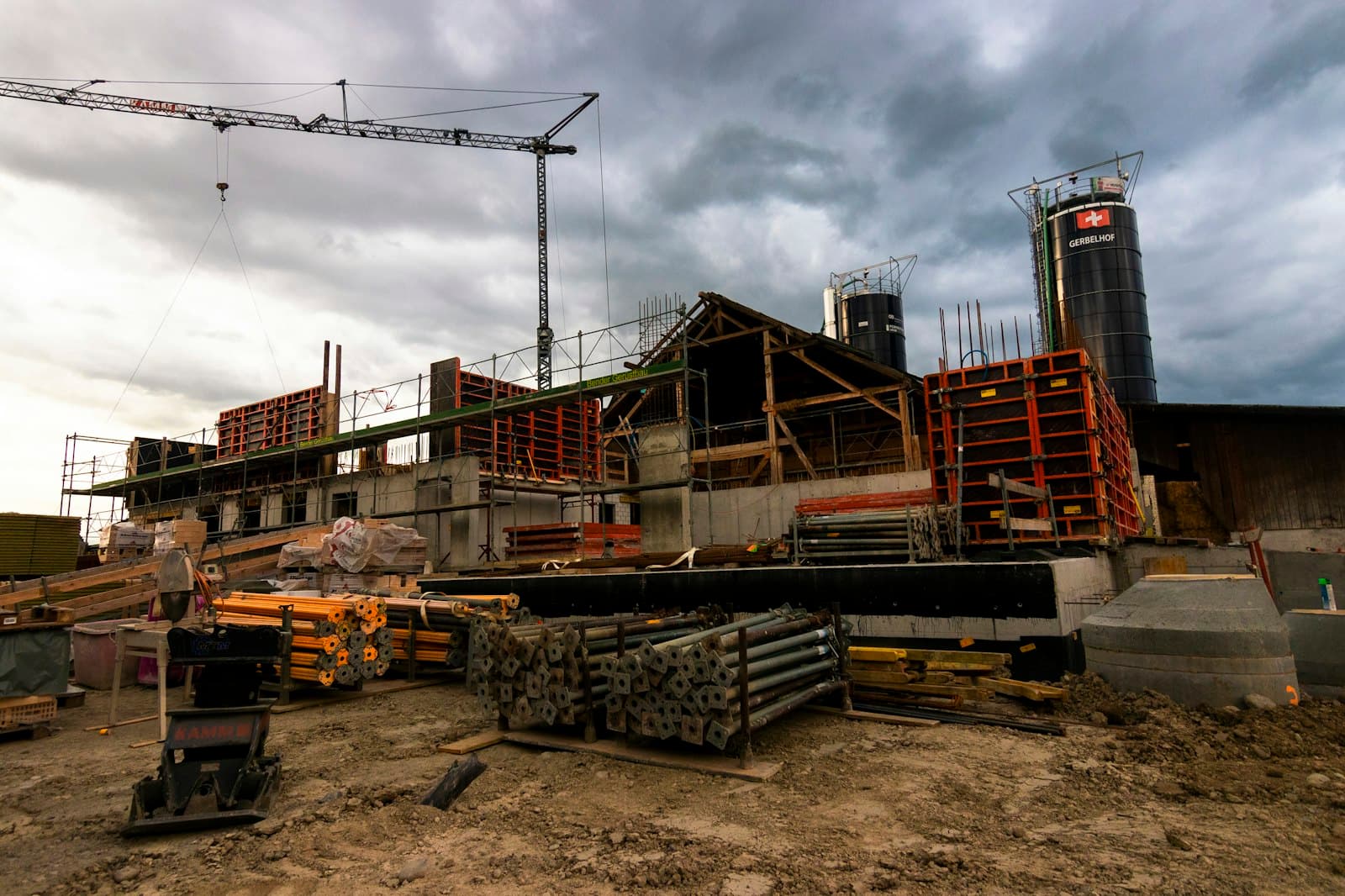 A construction site with a crane in the background