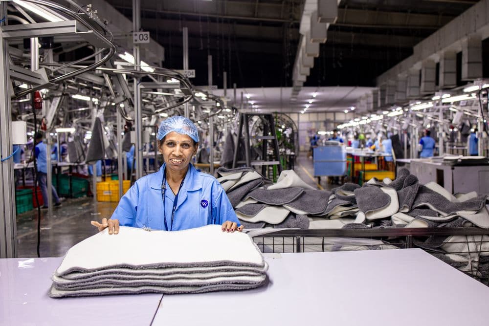 A factory worker preparing products for shipment A factory worker preparing products for shipment