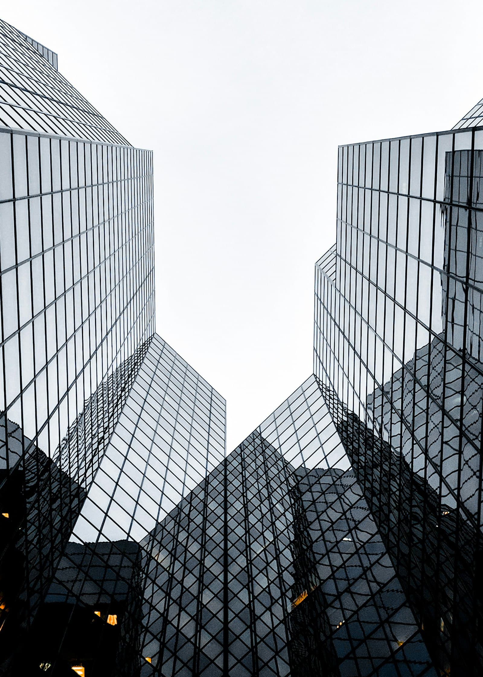 A commercial glass office building viewed from below A commercial glass office building viewed from below